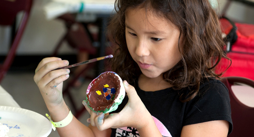 Girl painting in Kids on Campus