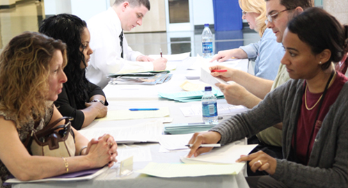 Resumes being reviewed at Job Fair